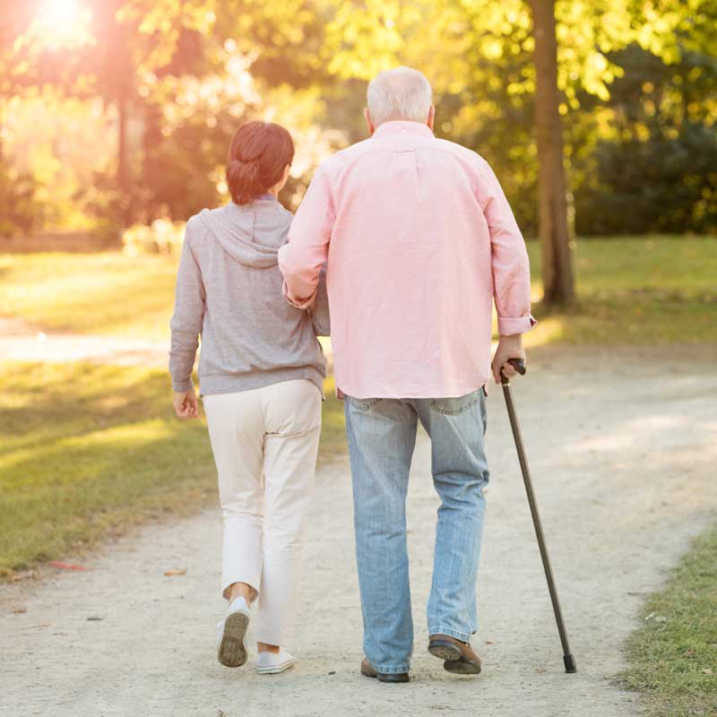 Elderly couple going to a walk