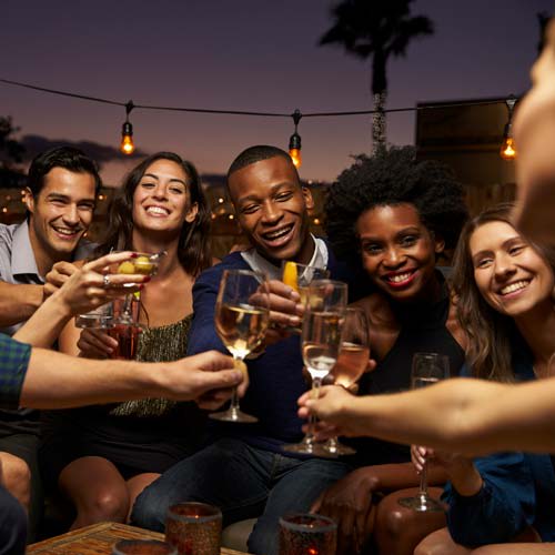 Friends enjoying each others' company at local club near Lola Apartments in Riverview, Florida