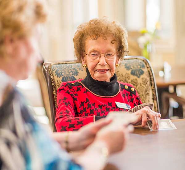 Ladies at Solana at The Park play cards together.