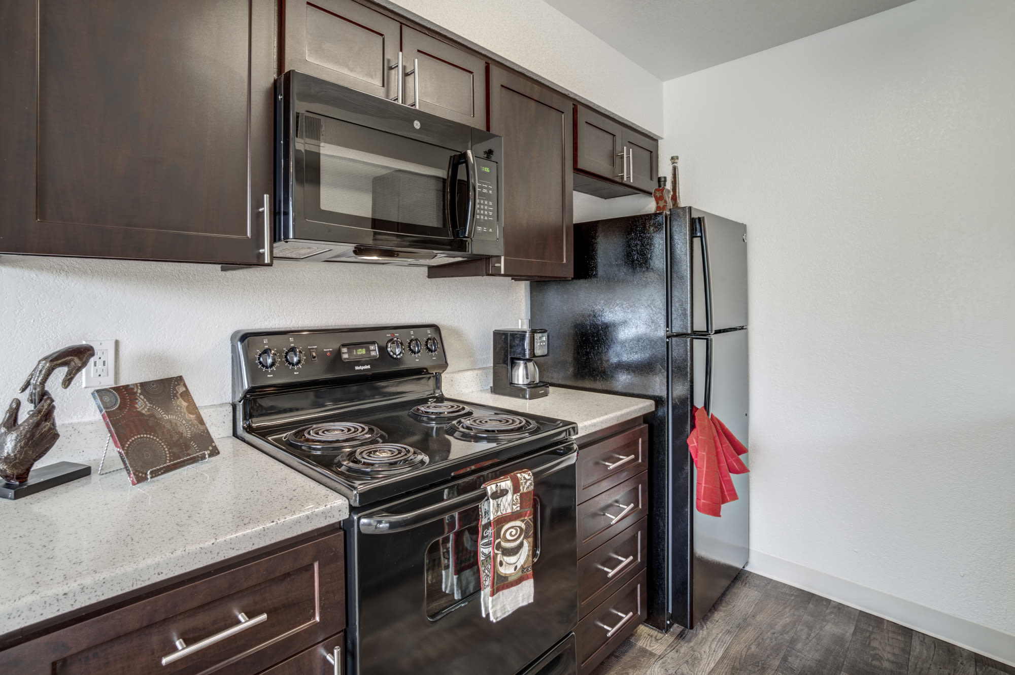 brown renovated model Kitchen at Parkside Commons Apartments in San Leandro