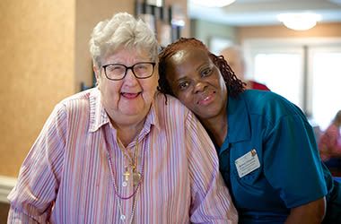 Resident and caregiver at Clermont Park in Denver