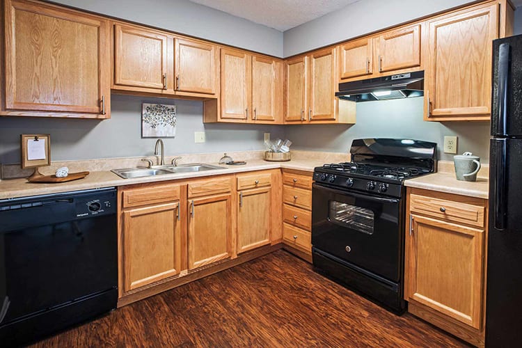 Modern kitchen with black appliances at The Edge At Arlington