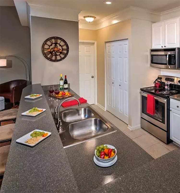 View of modern kitchen in apartment home at The Waterfront Apartments