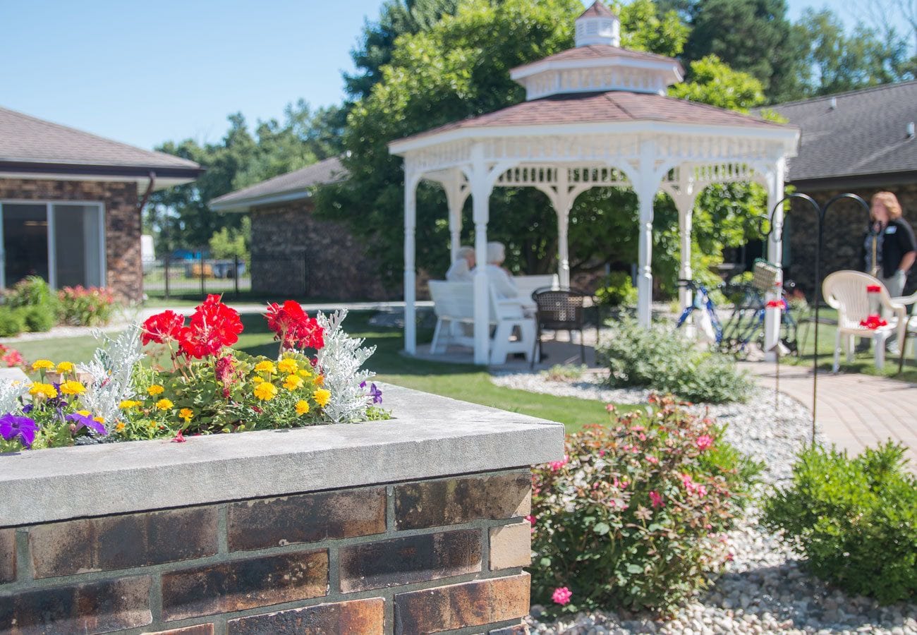 Patio with a white gazebo at White Oaks in Lawton, Michigan