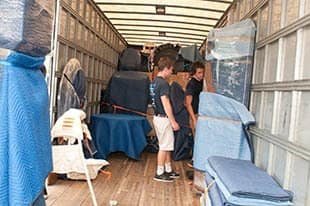 Movers inside a moving truck at Virginia Varsity Transfer & Storage