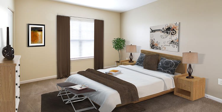 Well decorated bedroom at Ethan Pointe Apartments home in Rochester