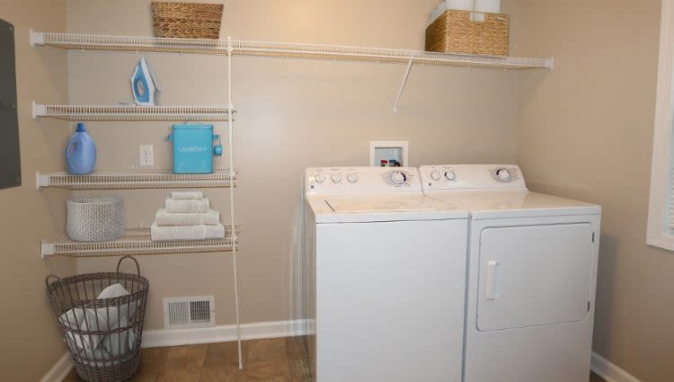 Washer and dryer at North Ponds Apartments home