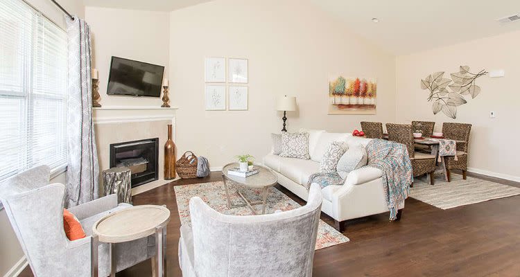 Luxury living room at Orchard View Senior Apartments home in Rochester