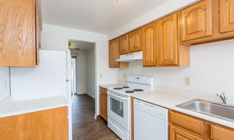 Well-equipped kitchen at Riverton Knolls home in West Henrietta, NY