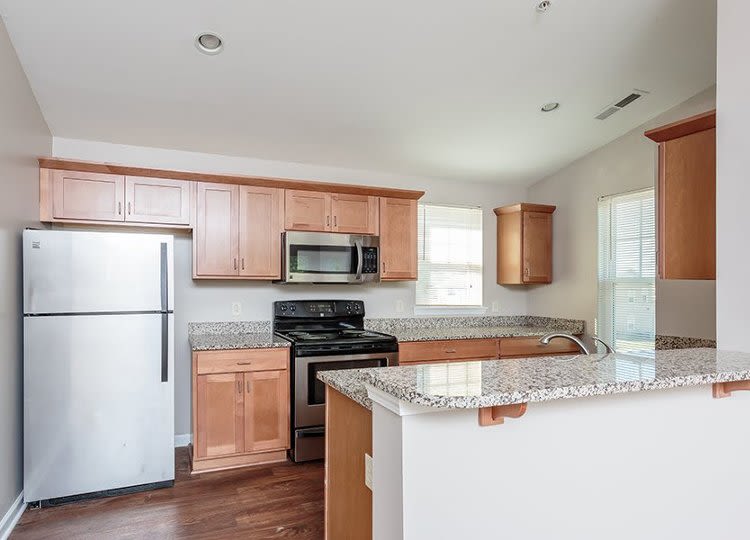 Well-equipped kitchen at Webster Green in Webster, New York