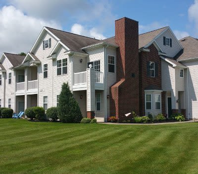 Front exterior view of apartments at Webster Green in Webster