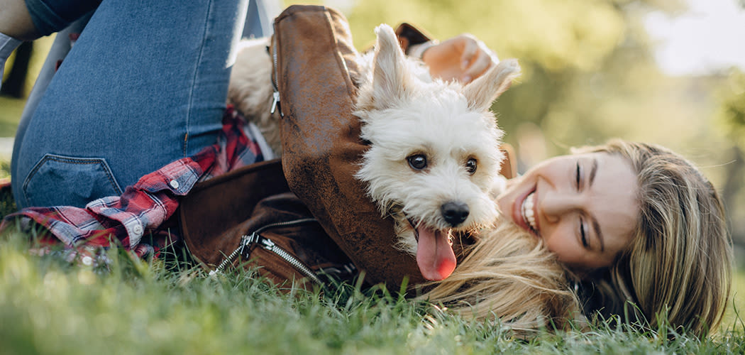 Resident playing with her dog at Addison Keller Springs