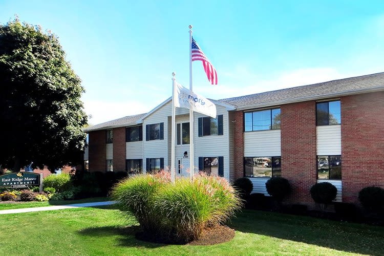 Landscaping and flag at East Ridge Manor Apartments