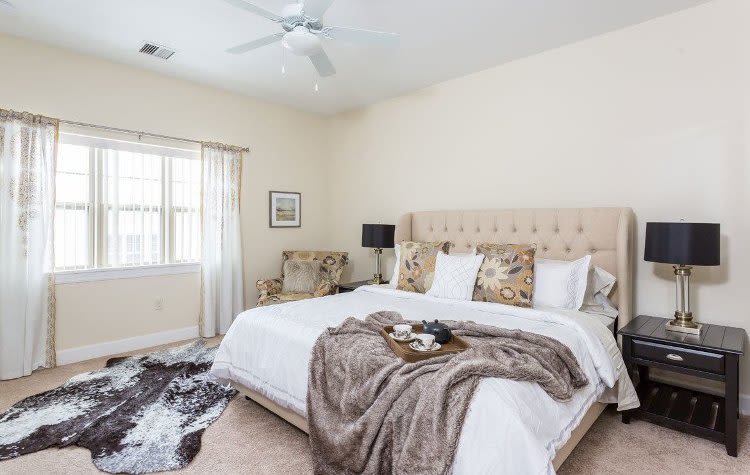 Beautifully designed bedroom at Gateway Landing on the Canal in Rochester