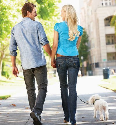 Couple walking at Willowbrooke Apartments and Townhomes in Brockport, New York