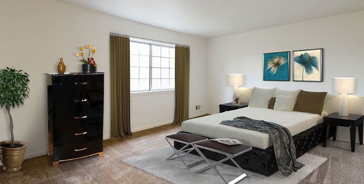 Well decorated bedroom at Elmwood Terrace Apartments & Townhomes home in Rochester