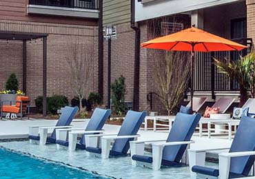 Poolside lounge chairs at 675 N Highland