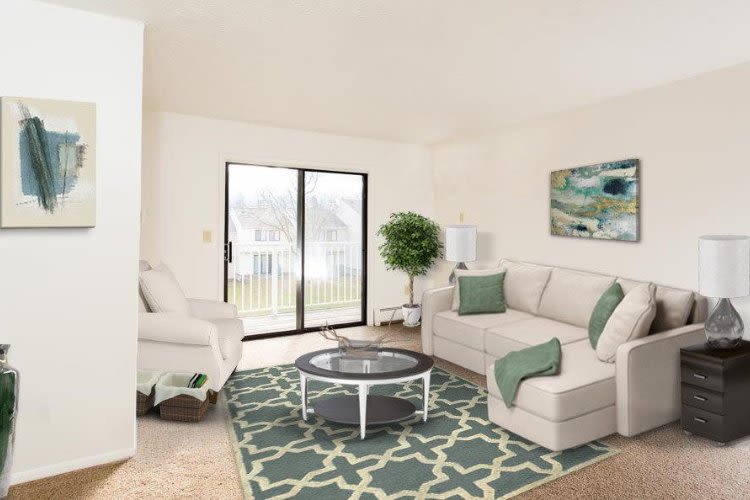 Enjoy a living room at Penbrooke Meadows Apartments in Penfield