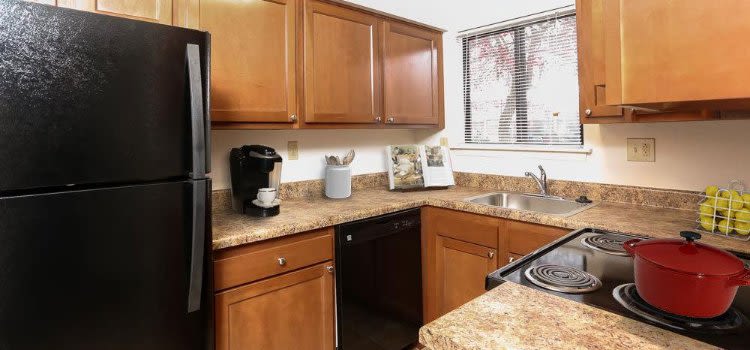 Well-equipped kitchen at Penbrooke Meadows Penfield, New York