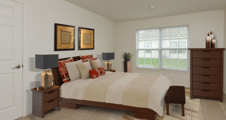 Well decorated bedroom at Villas of Victor and Regency Townhomes home in Victor