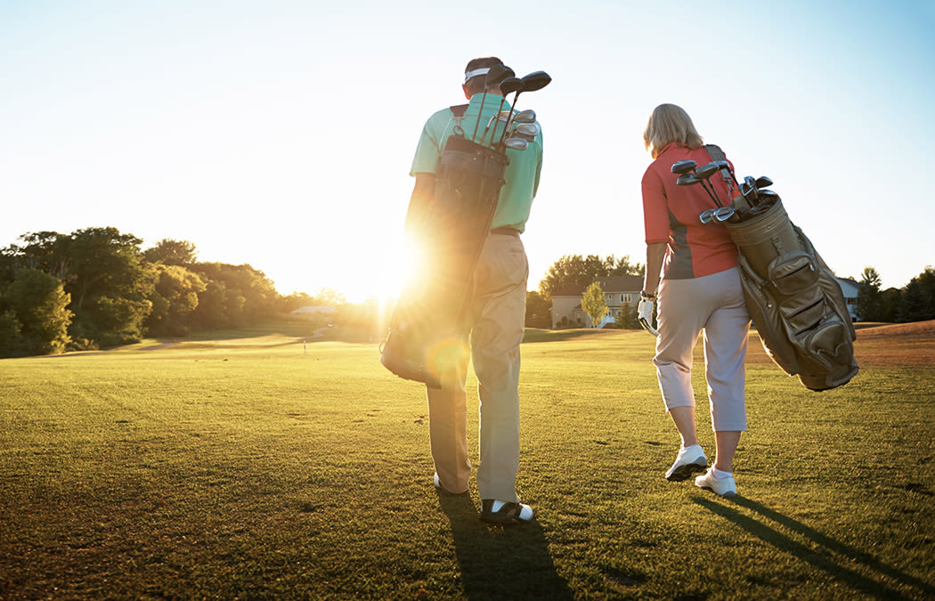 Residents of The Fairways of Ironhorse golfing at sunset