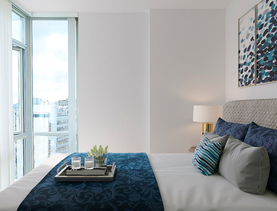 Beautiful bedroom at Bayview at Coal Harbour in Vancouver, British Columbia