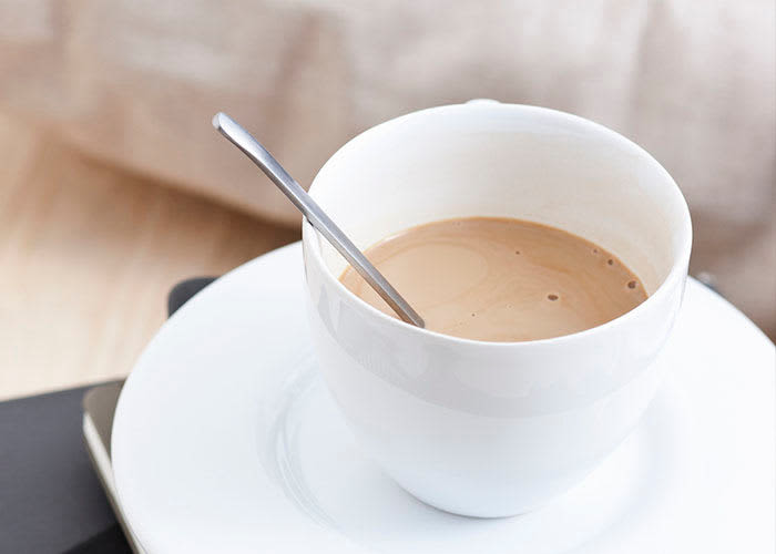 Relaxing with a warm beverage at Bretton Place in Toronto