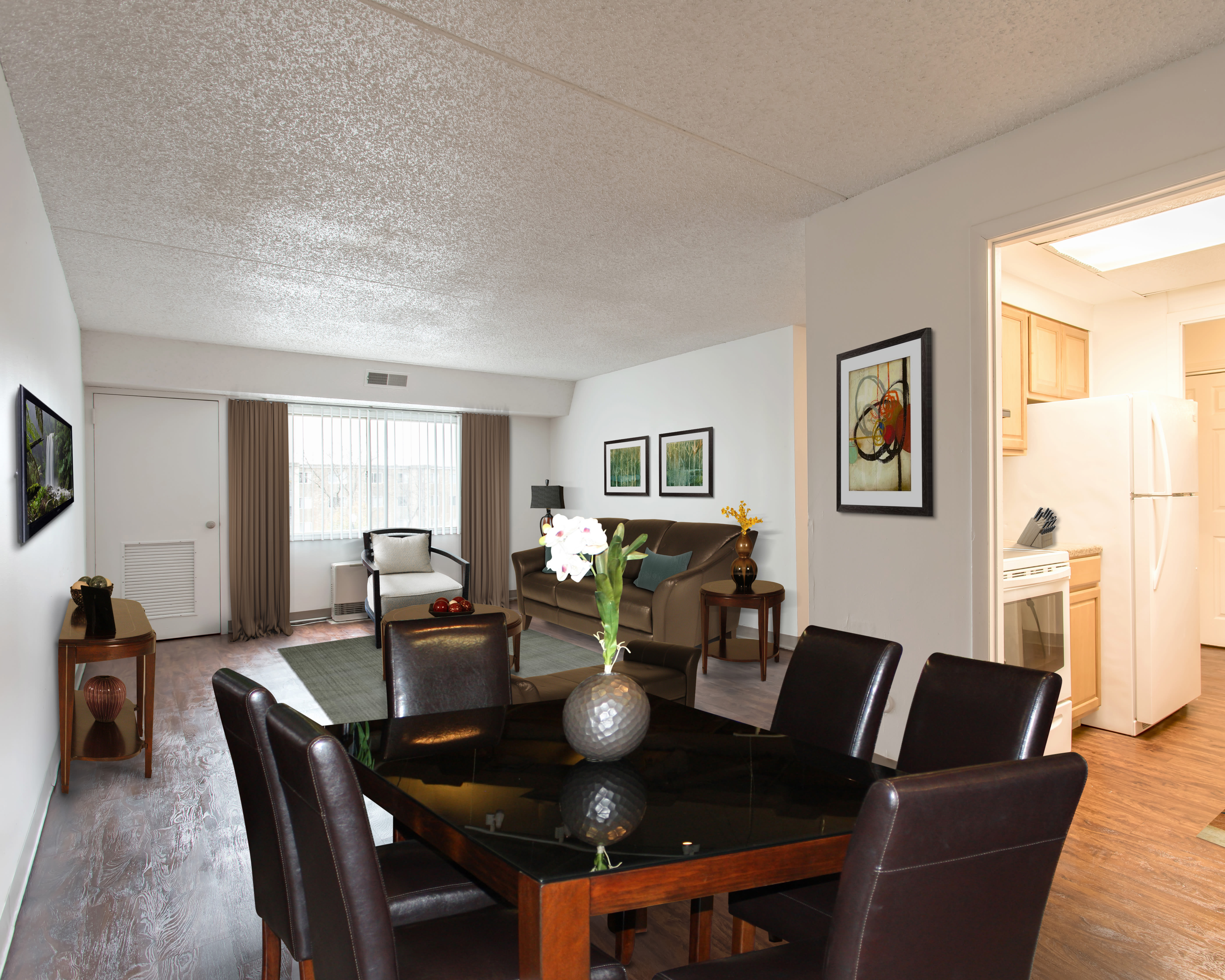 Natrually well-lit living room at Park Guilderland Apartments in Guilderland Center, New York