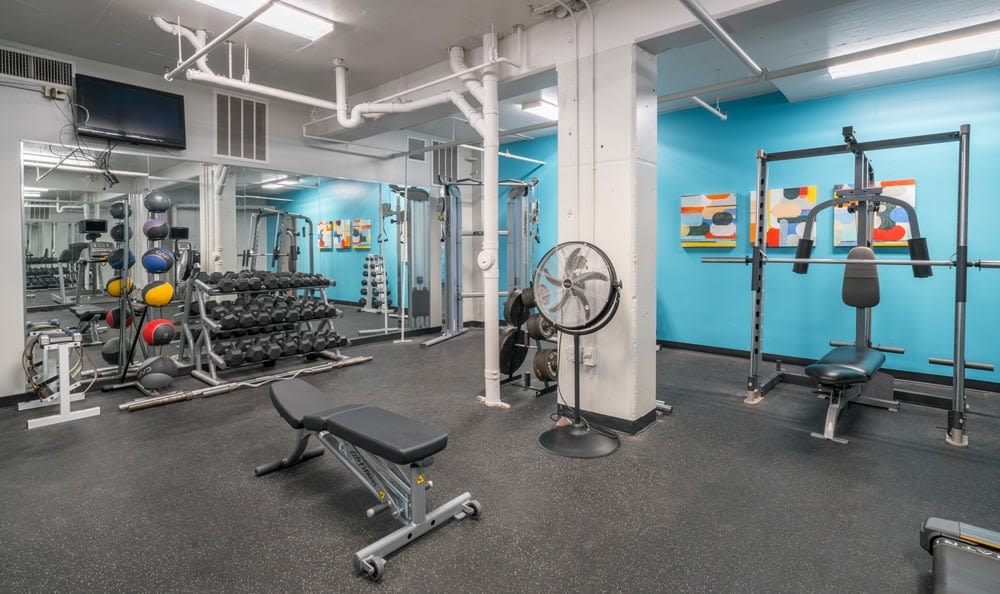 Modern fitness center at The Enclave at 1550 Apartments in San Antonio, Texas