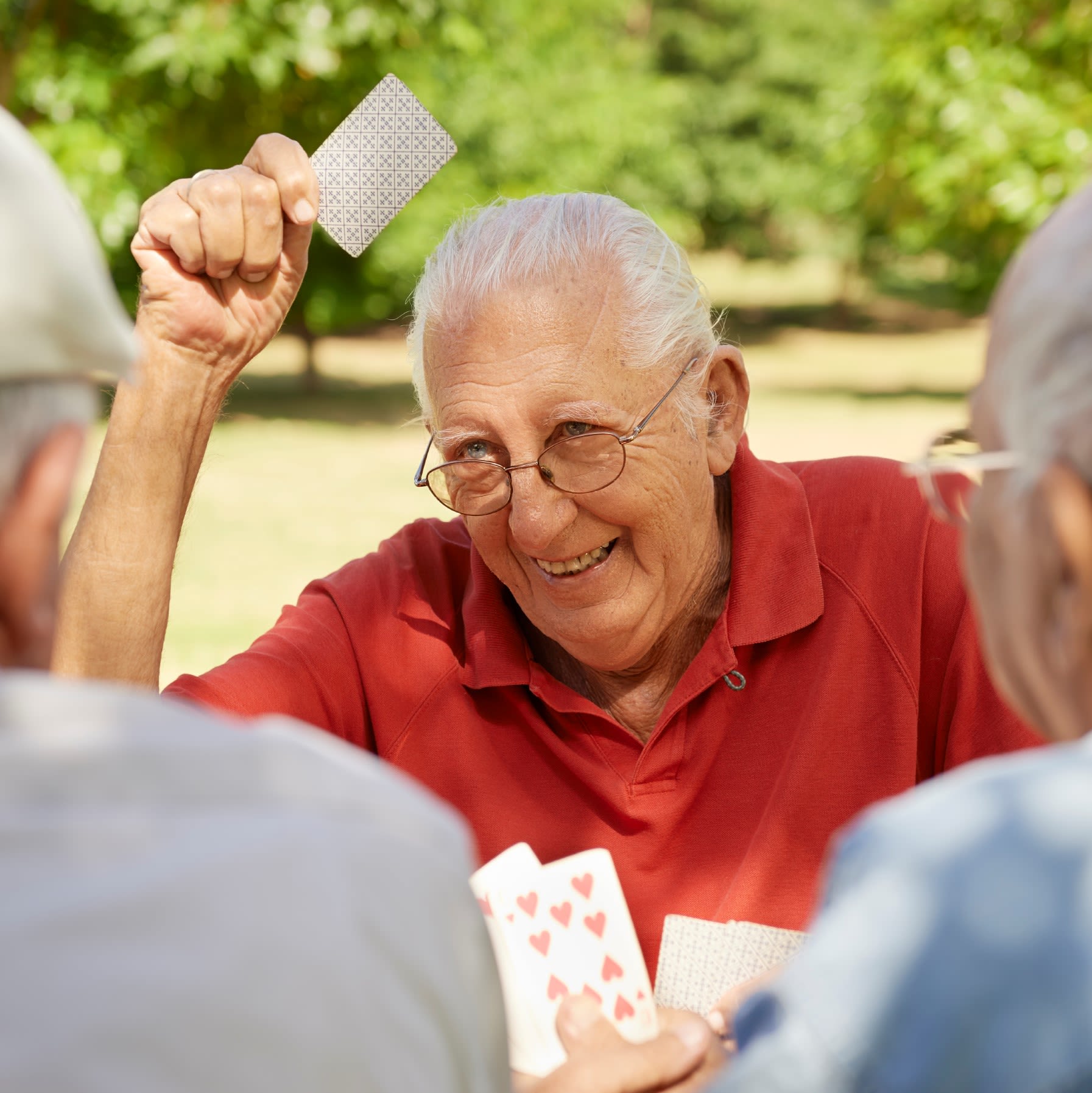 Senior man playing cards