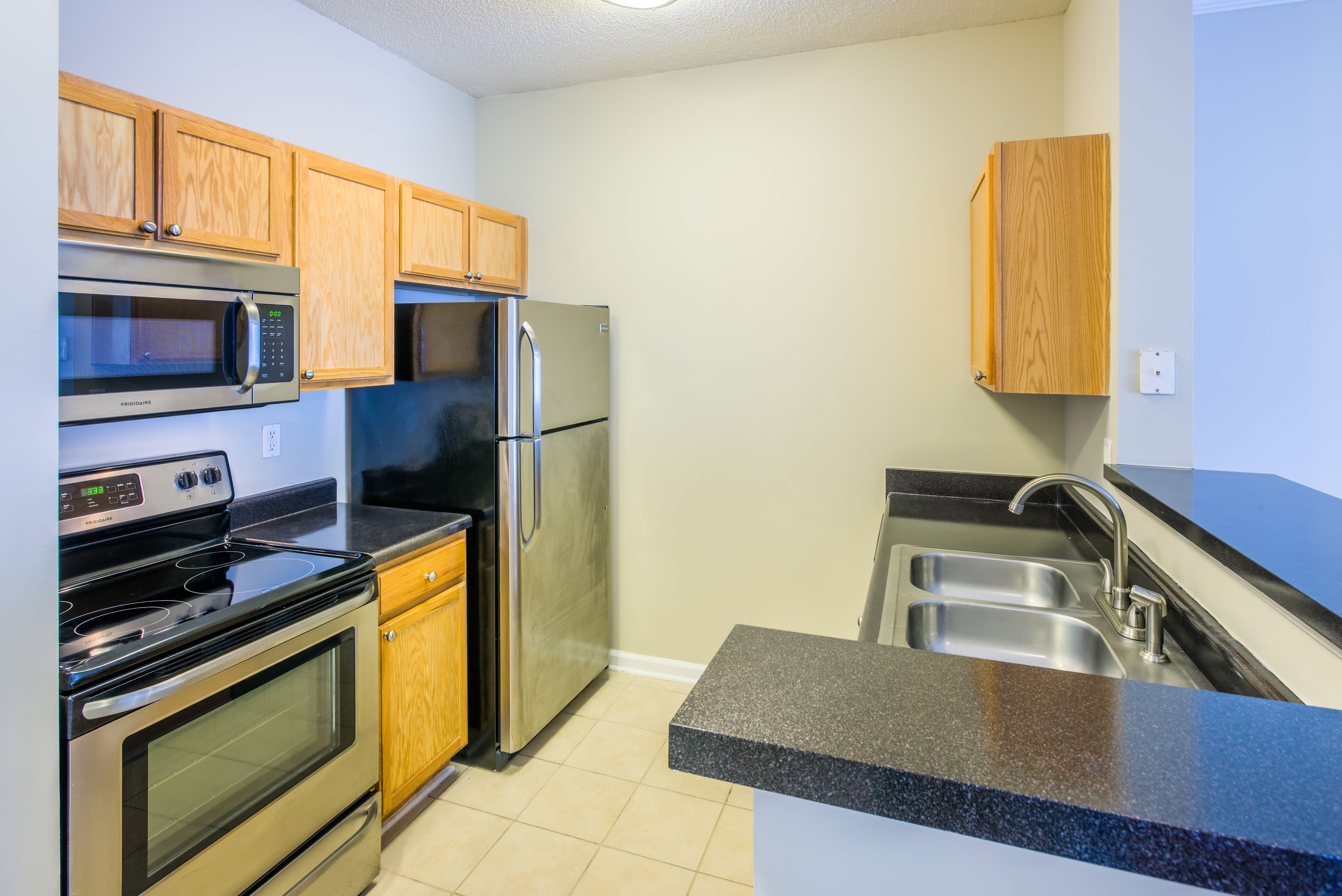The Avant at Steele Creek offers a cozy bedroom in Charlotte, North Carolina