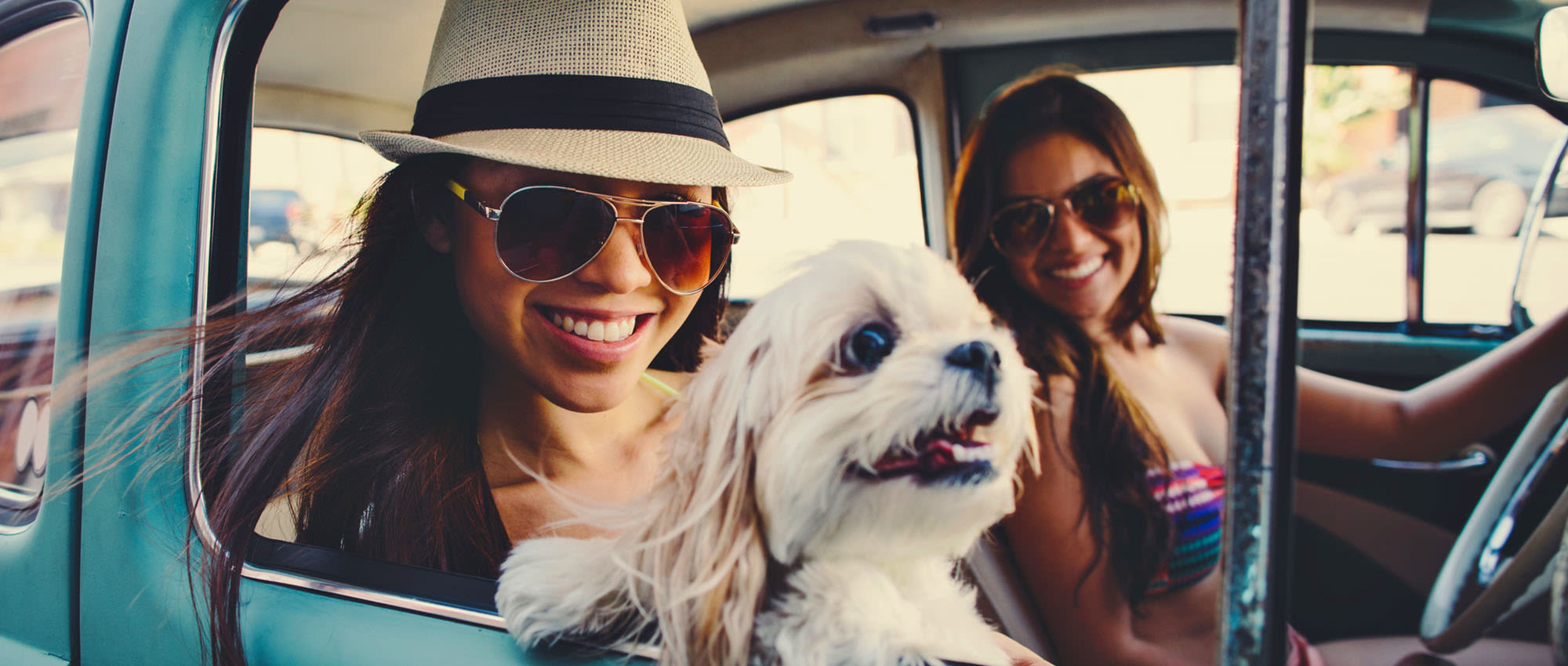 Girls with a cute doggy at University Pet Resort in Merced, California