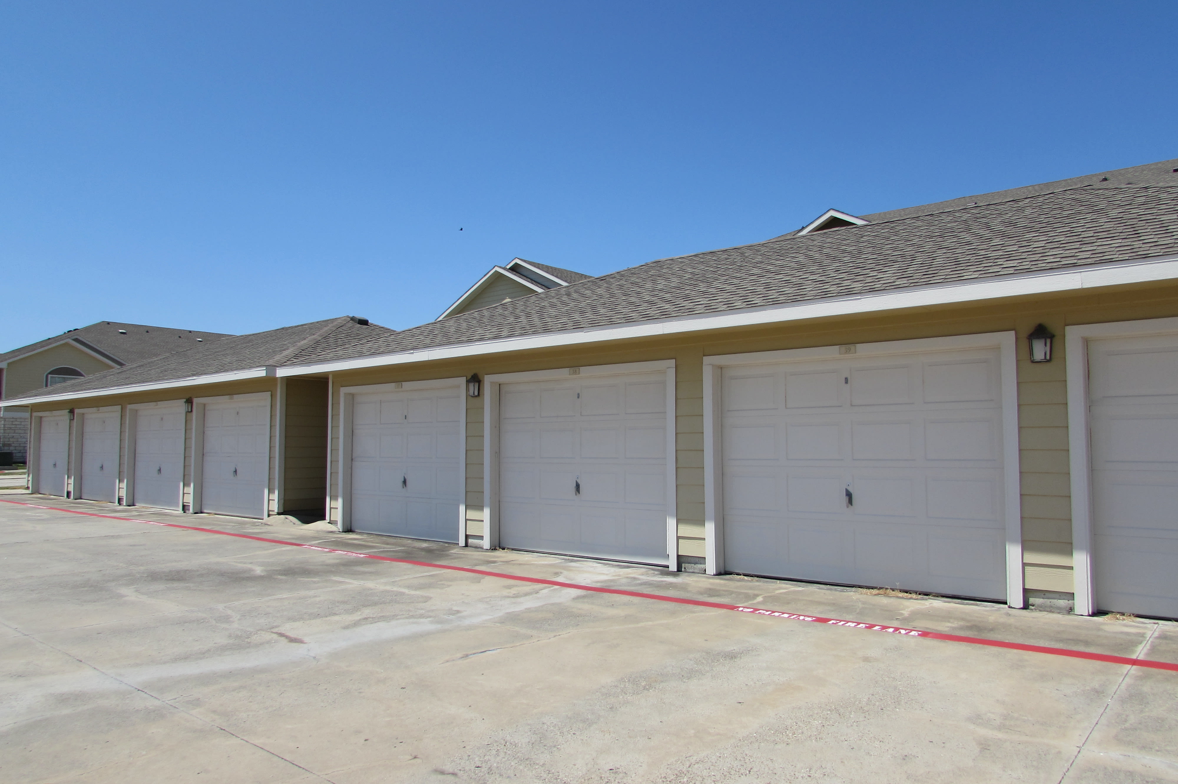 Private resident garages at Pavilions at Northshore in Portland, Texas