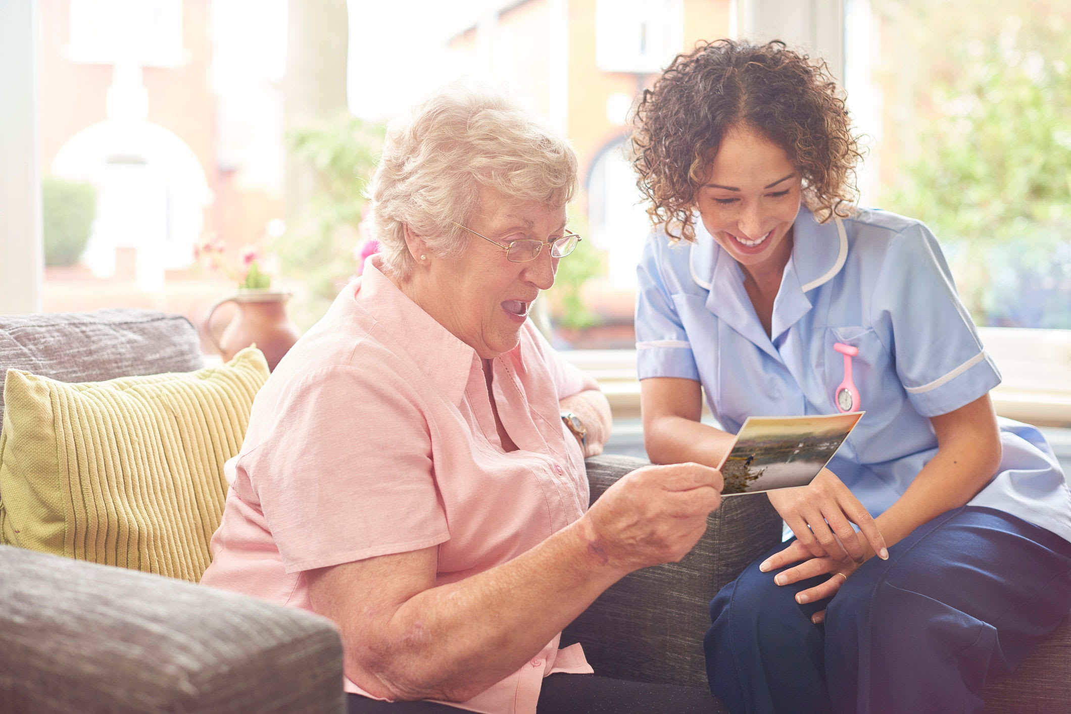 Girl is reading to lady at Clearwater at South Bay in Torrance, California