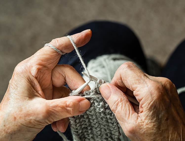 Senior making clothing at Huntington Terrace in Huntington Beach, California