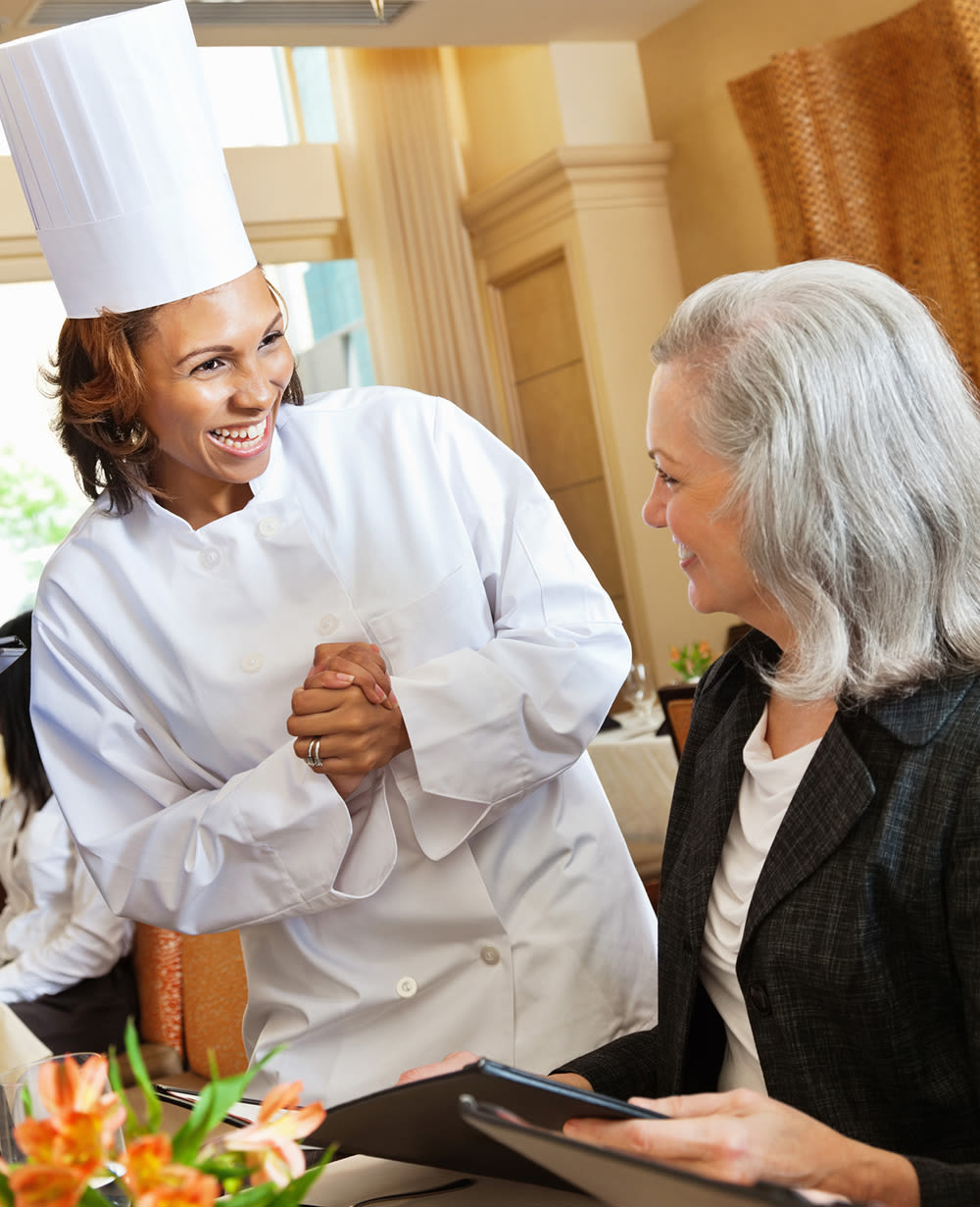 Chef with senior at Chancellor Gardens in Clearfield, Utah