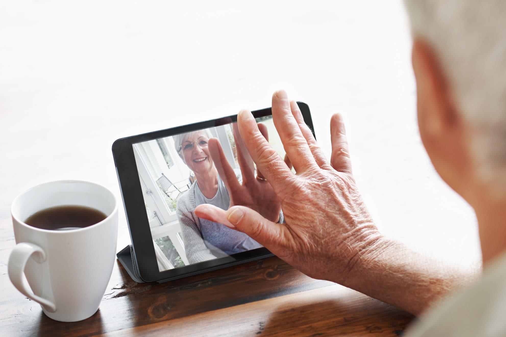 Senior using iPad at Maplewood Senior Living in Westport, Connecticut