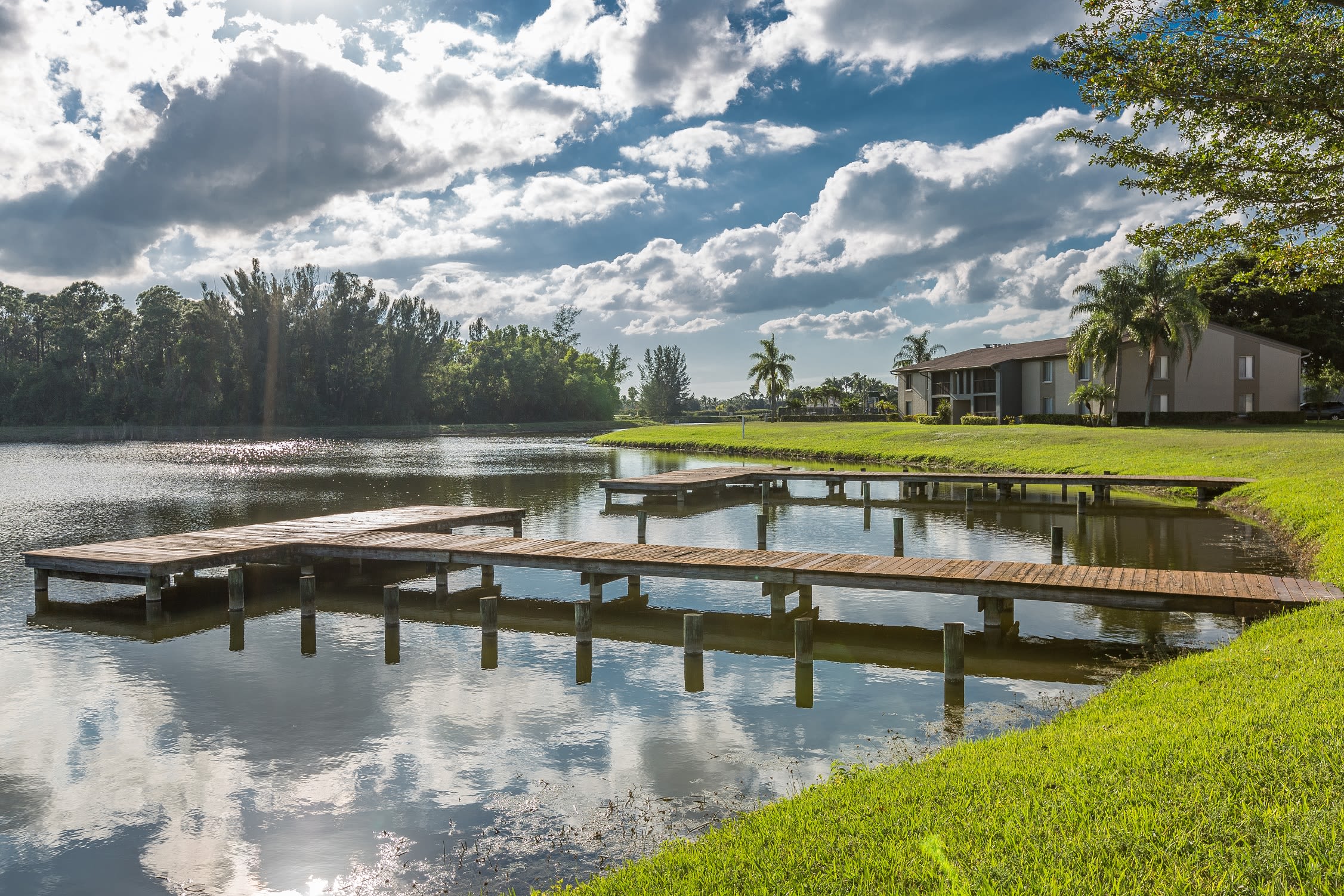 Picnic area with views of the lake at Verse at Royal Palm Beach in Royal Palm Beach, Florida
