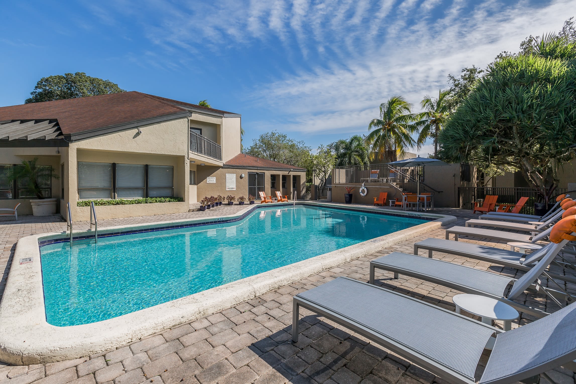Gorgeous swimming pool area on a beautiful day at Siena Apartments in Plantation, Florida