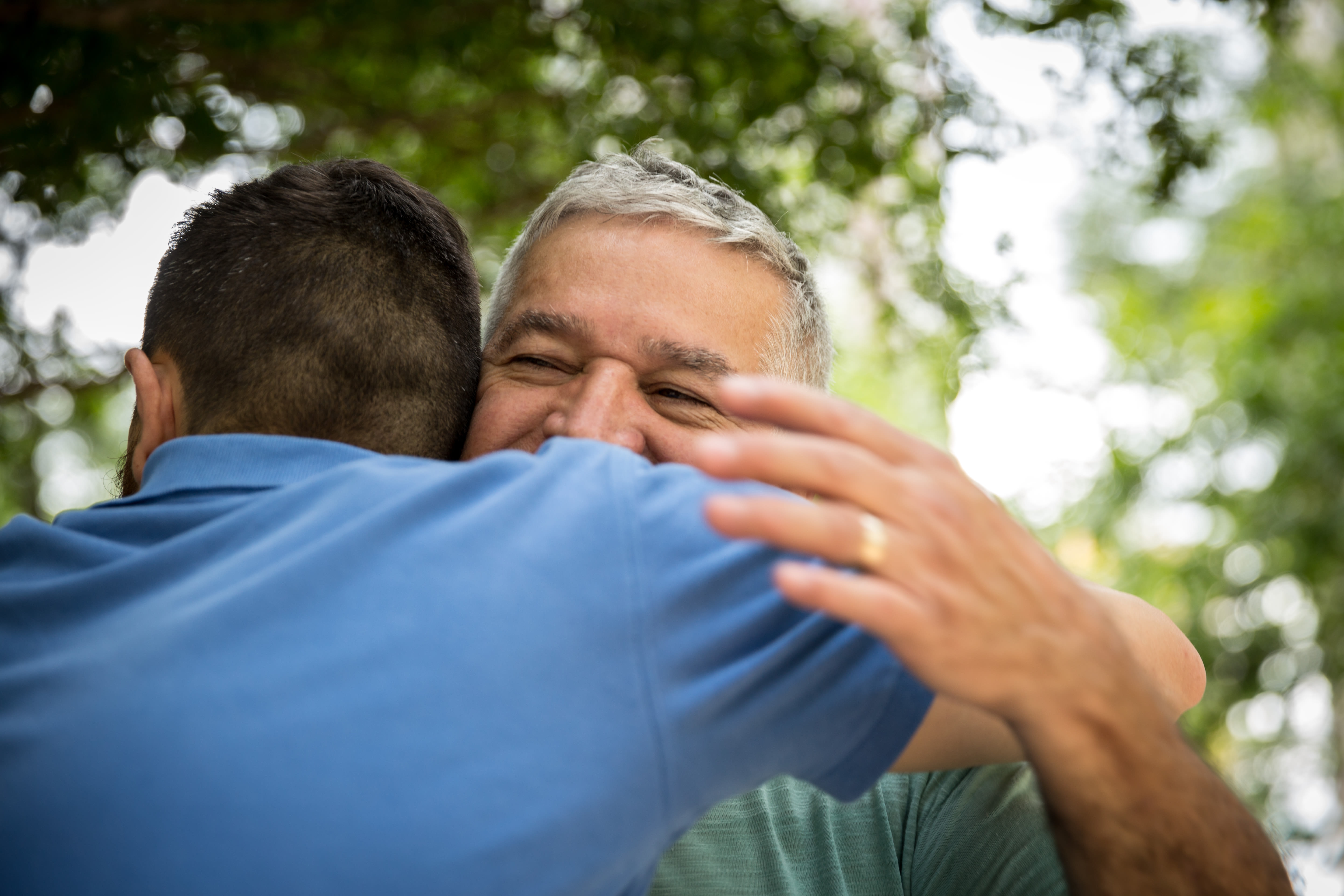 A resident and their family member hugging at Almond Heights in Orangevale, California