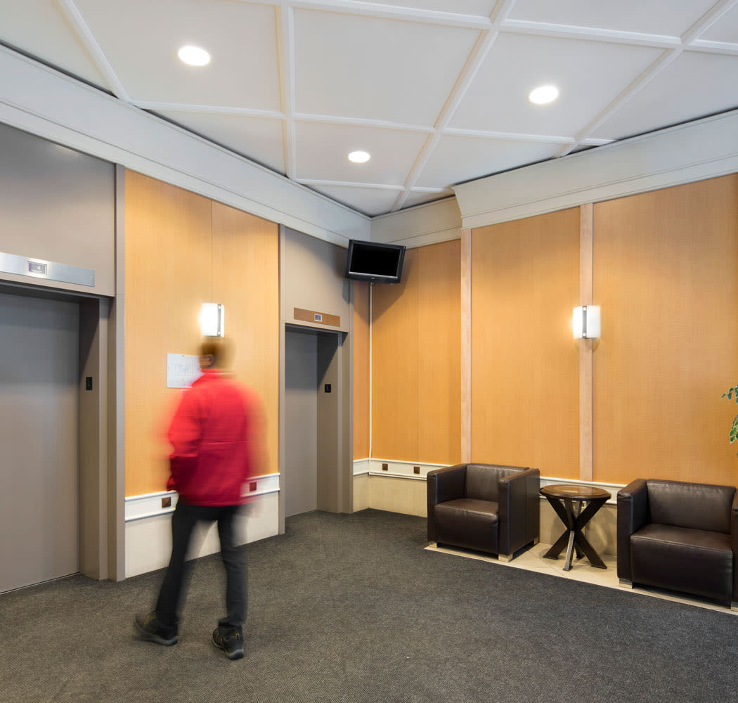 Elevators in the lobby at Calgary Place Apartments in Calgary, AB