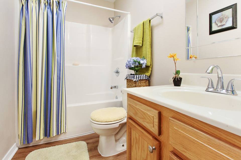 at Summerfield Apartment Homes features a bathroom  in Harvey, Louisiana