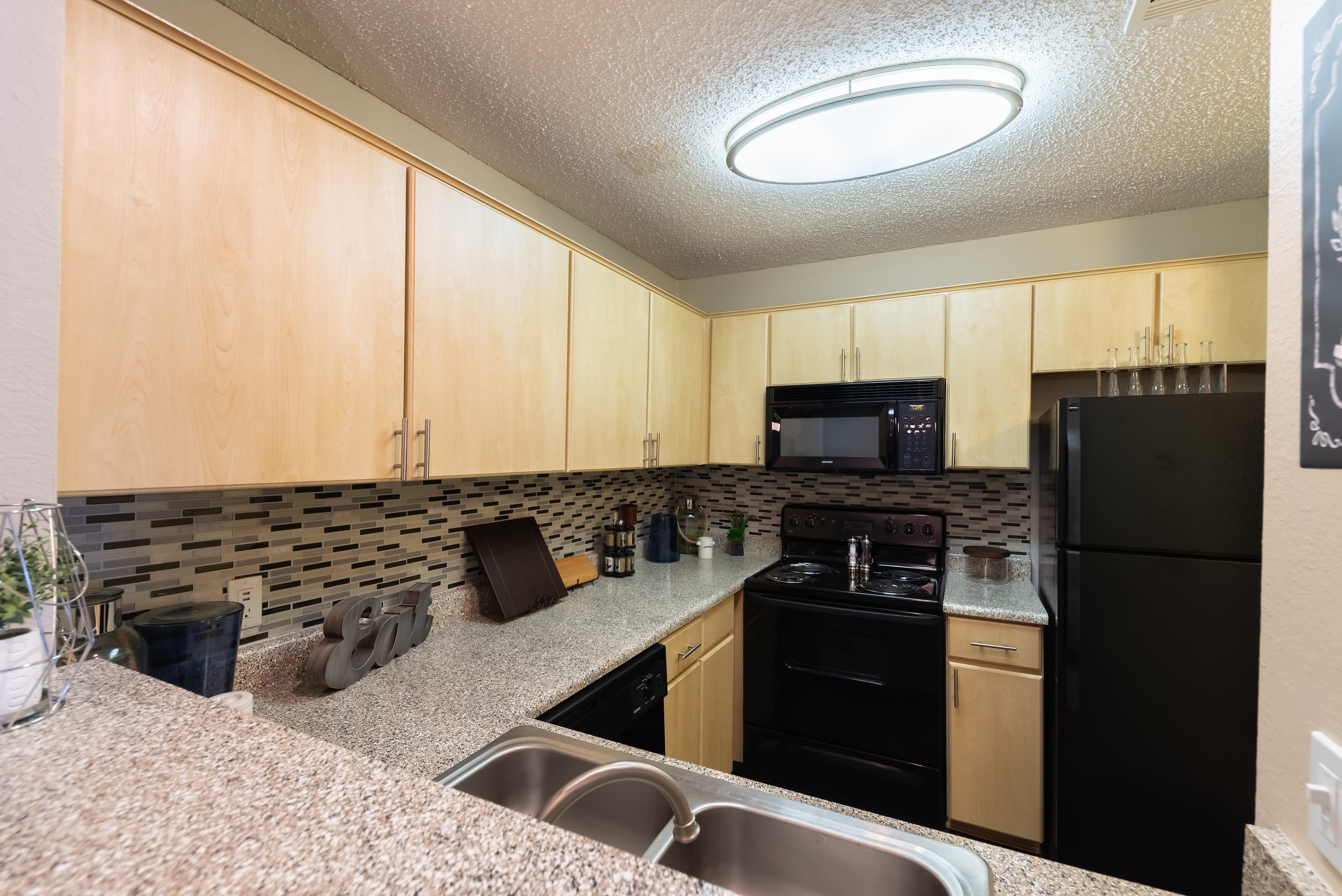 Kitchen of model home at Village Green of Bear Creek in Euless, Texas