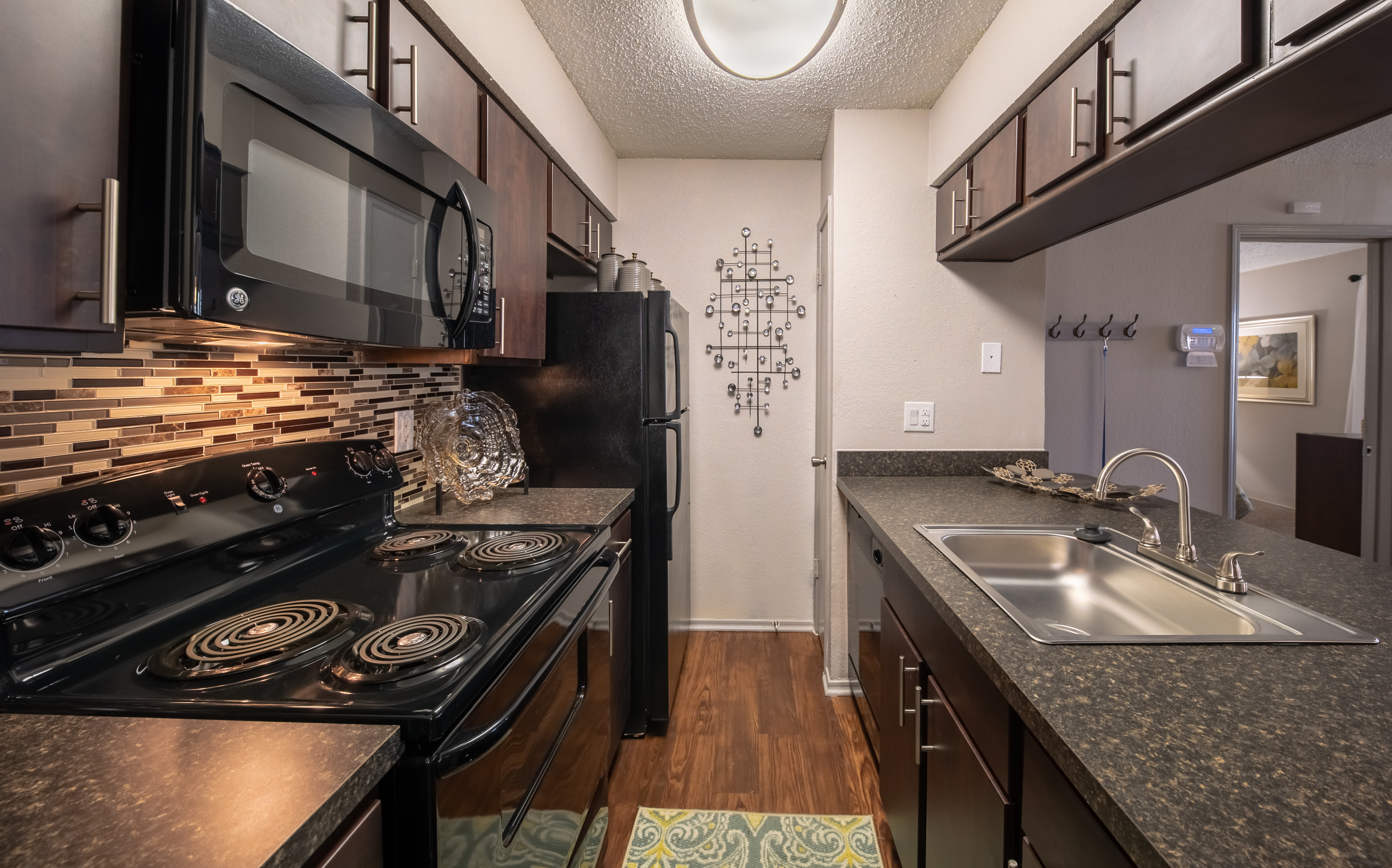 Kitchen with designer cabinetry at Trails of Towne Lake in Irving, Texas