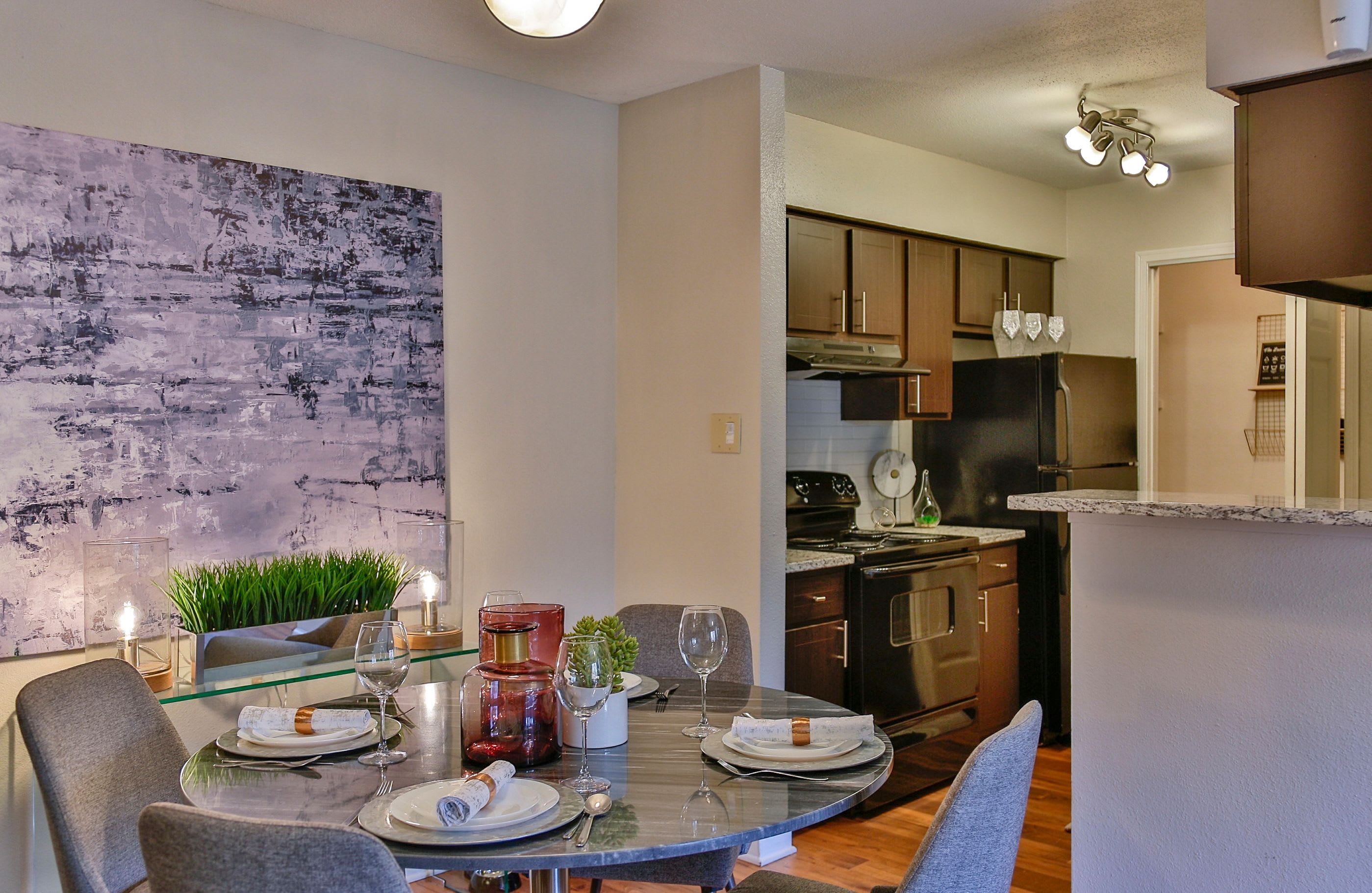 Family photo in model home with lot's of nature lighting at Allegro on Bell in Antioch, Tennessee