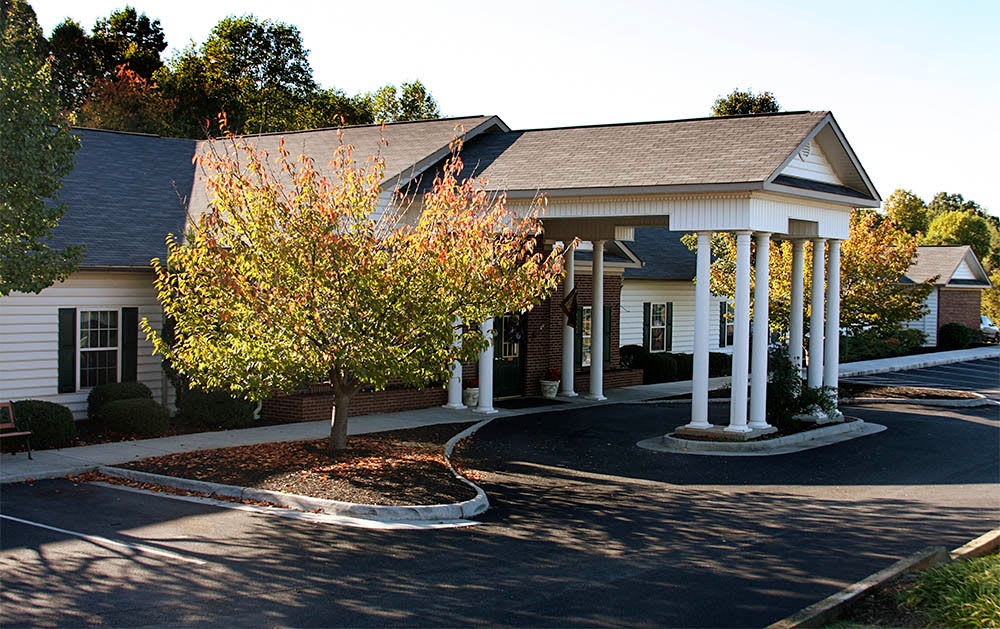Driveway and main entrance to Heritage Green Assisted Living and Memory Care in Lynchburg, Virginia