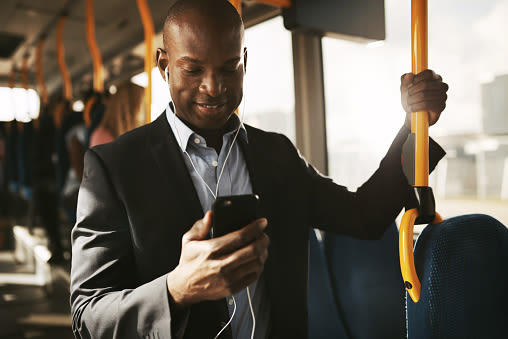 Man on the subway on his phone near Berkshire Stewards Crossing in Lawrenceville, New Jersey