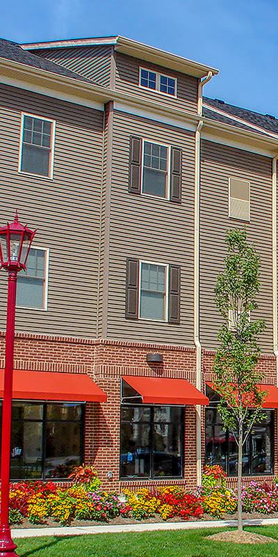Front exterior view of apartments at Rochester Village Apartments at Park Place in Cranberry Township, PA