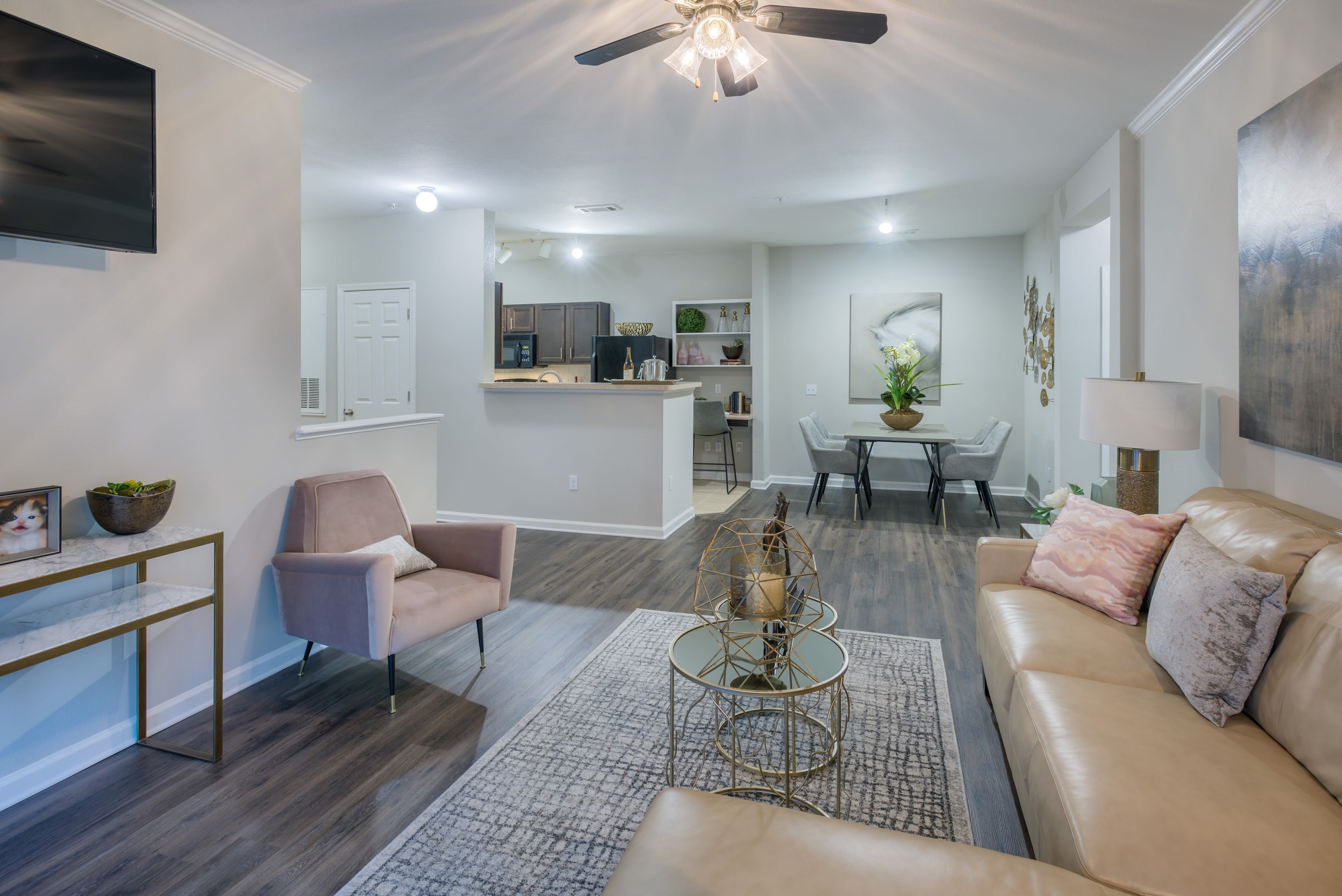Open concept floor plan with hardwood floors and modern decor at The Vive in Kannapolis, North Carolina