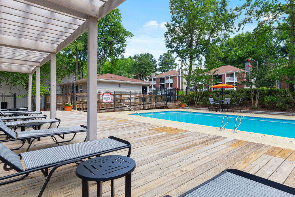 Poolside lounge chairs at Austell Village Apartment Homes in Austell, Georgia